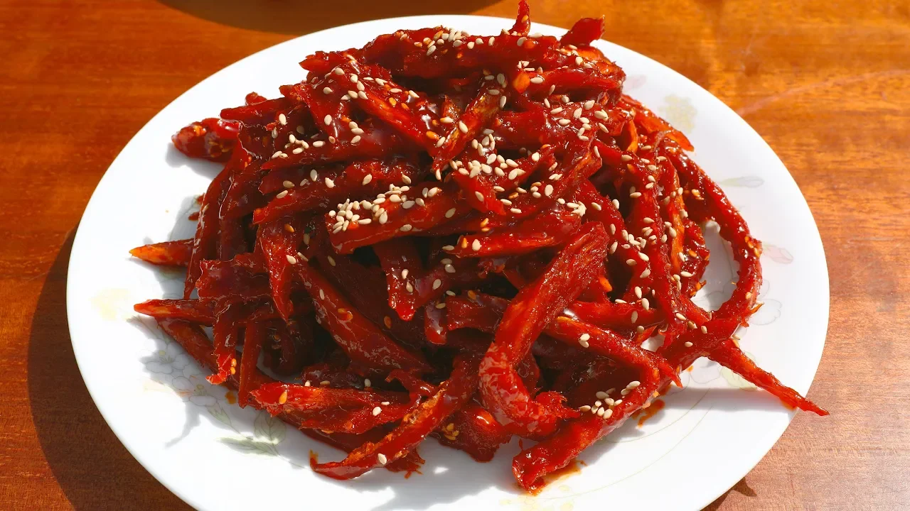 Dried shredded pollock seasoned with gochujang (Bugeopo gochujang-muchim:  )