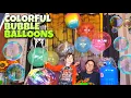 Vergelijking van opblazende kleurrijke bubbel-Bobo-ballonnen LED-feesthelium en luchtgevulde ballonnen DISCO BALL