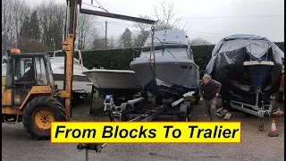 Moving a boat to a trailer. The old school way.