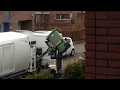 Garbage truck emptying garbage bins