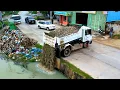 Lagu Amazing job the big pond filling by dump truck unload and bulldozer KOMAT'SU push the stone
