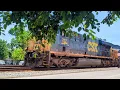 Northbound CSX E700 empty coal hoppers with mid-train DPU on track one heading to Newell PA