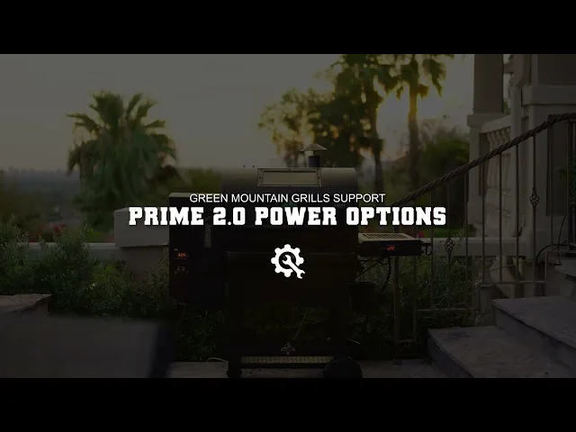 Green Mountain Grills TREK Prime 2.0 pellet grill with power options displayed, surrounded by greenery and steps, emphasizing grill setup and operation.