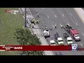 Aerial shows tow trucks remove crashed cars on Turnpike