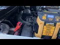 Jump starting a car pickup truck with an Everstart car battery starter