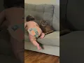 Baby Tries to Sit With Cat on Couch