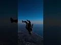 Download Lagu Skydiver Free-Flies Upside Down Over Landscape - 1382104