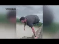 Viral shows man jump from I-10 bridge during gridlock
