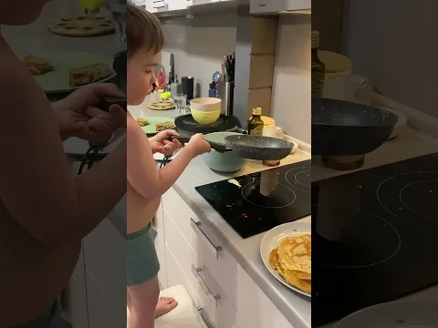 Boy makes pancakes for the first time in Ramenskoye, Moscow, Russia