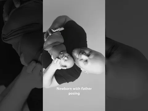 Newborn with father posing