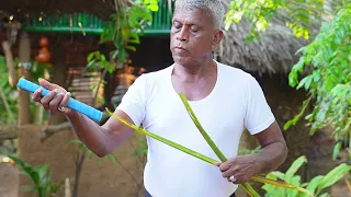 How to put a Grip on a Coconut using Coconut Leaves 