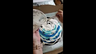 Big blue marble on vinyl record Dutch pour paint
