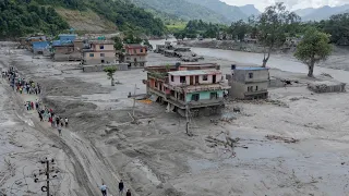 Death toll rises in Nepal-China border disaster as lake poses new flood threat
