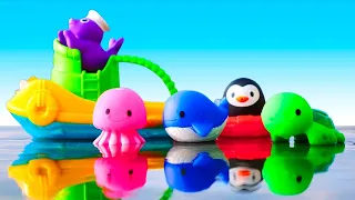 Playing with toy boats and toy sea animals in a video for kids.