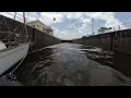 Taking a sailboat though the St Lucie Lock on a hip tow in Stuart Florida