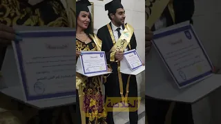 سمية الخشاب تلتقط الصور بعد منحها الدكتوراة امام صور العلماء و الباحثين 