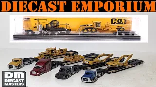 1 87 HO Scale Diecast Masters Semi Tractor with Lowboy Trailer and CAT Machines - Complete Set
