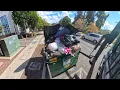 Waste Management front load garbage truck dumping bins