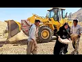 Download Lagu Nomadic life on a stormy day: The power of a loader to move rocks