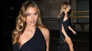Arabella Chi goes braless in a revealing one-shoulder black maxi gown with racy thigh-high split