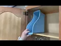 Put a Dollar Store book bin in your kitchen cabinet this is BRILLIANT