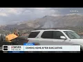 Many evacuees returning home as fire activity stabilizes