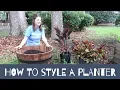 How to style a raised planter whiskey barrel with plants and flowers