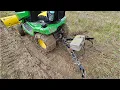Testing a cultivator attachment with a John Deere X380