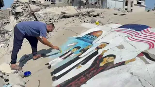 لوحة جدارية على ركام غزة تنفيذ الفنان احمد السحار وعبد الله ابو القمبز وإسماعيل القطراوي