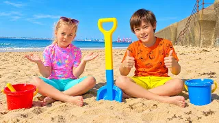 Kids on the Beach Playing Sand and other Kids Toys