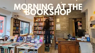 Morning at the bookshop books delivery making coffee for the customers