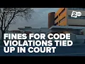 Fines for code violations at Portland ICE facility remain tied up in court