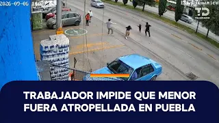 Trabajador reacciona a tiempo y evita que una niña sea atropellada en Puebla