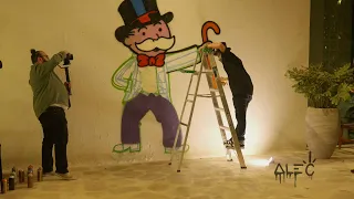 ALEC MONOPOLY Painting mural at the FIFA WORLD CUP DOHA QATAR