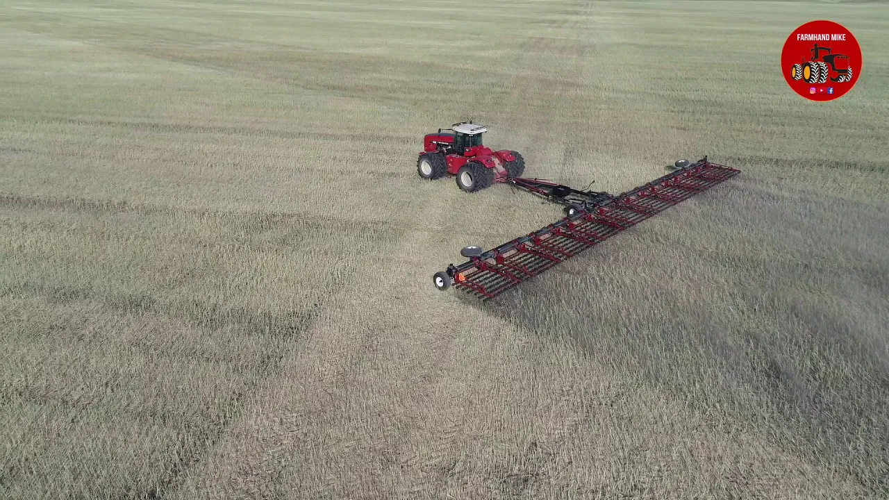 Versatile 575 Tractor pulling a Elmers Super 7 Harrow in Manitoba Canada