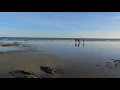 Walking Hampton Beach State Park New Hampshire during low tide