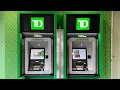 Wit rawing a 20 bill using the new TD Canada Trust Green Machine ATMs Vancouver BC - May 25 2024