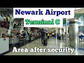 Walking in Terminal C at Newark Liberty Int l Airport in Newark NJ USA Area after security