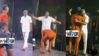 kofi kinaata kneels before samini as he suprises him at the made in taadi concert