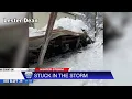 Collapsed roofs and dozens stuck from massive snowstorm