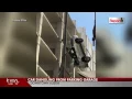 16 09 508 Brazos GTT Parking SUV dangles from downtown Austin parking garage after driver drives