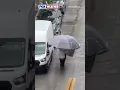 STAY COVERED Locals In Miami Are Not Messing Around With The Wet Weather