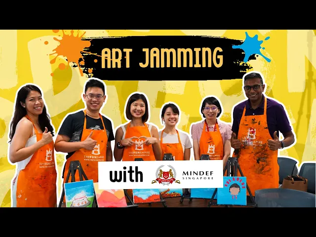 The MINDEF team in aprons at their art jamming session