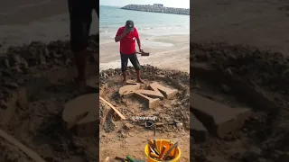 نحت على الرمل حرف الm 