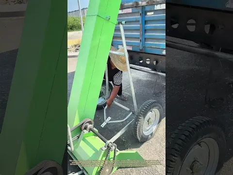 Harvest on the Go: A Combine Trails a Truck, Sweeping Grain from the Road