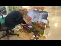 Inspiring artist paints with her feet after losing use of her arms