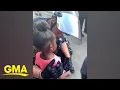 Download Lagu Police officer comforts little girl after she asks: 'Are you going to shoot us?' l GMA Digital