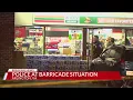 Wanted suspect holes up inside of Arlington convenience store shots reportedly fired