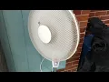 A worn out and tatty Argos value range 16” pedestal fan at my local community hall