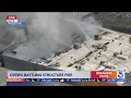Crews battle structure fire near Fullerton airport